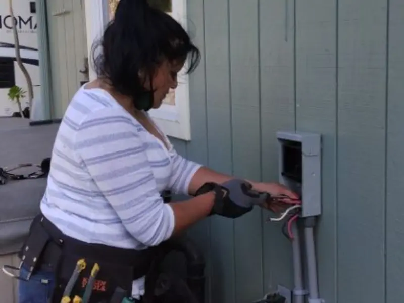Licensed electrician wiring an exterior subpanel in Bath